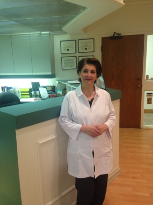 Dr. Azar Grakoui - Teeth Whitening Services