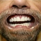 Yollick M Dr & Associates - Dentists